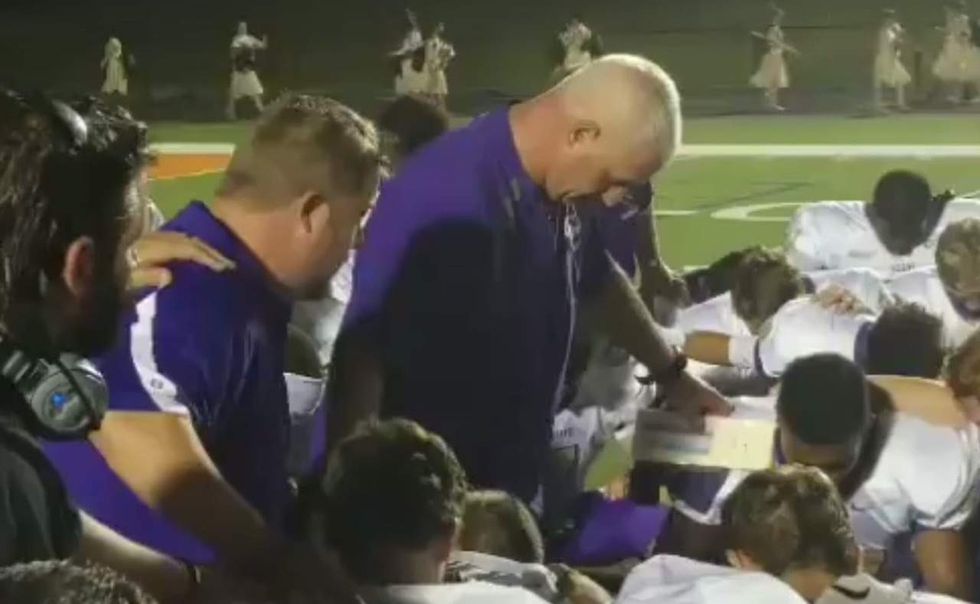 HS football coach seen in video apparently praying with players. Then atheists caught wind of it.