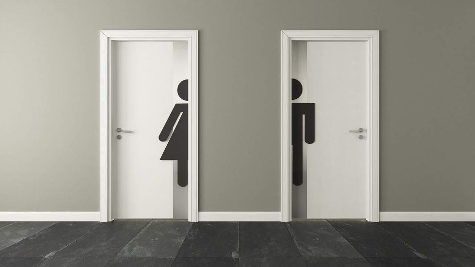 Listen: This restaurant got creative with bathroom door signs – offensive or not?