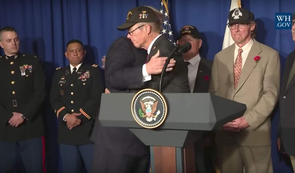 Watch: Vietnam vet cries on President Trump's shoulder after moving speech in Vietnam