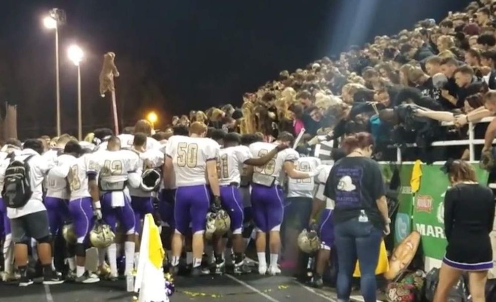 Atheists say they 'put an end' to coach praying with players — and students send a huge message back