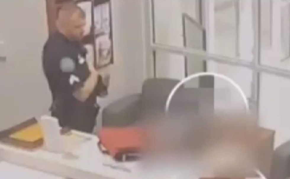 Middle school boy doesn't stand for pledge. Sheriff's deputy asks him to. Now his father is fuming.