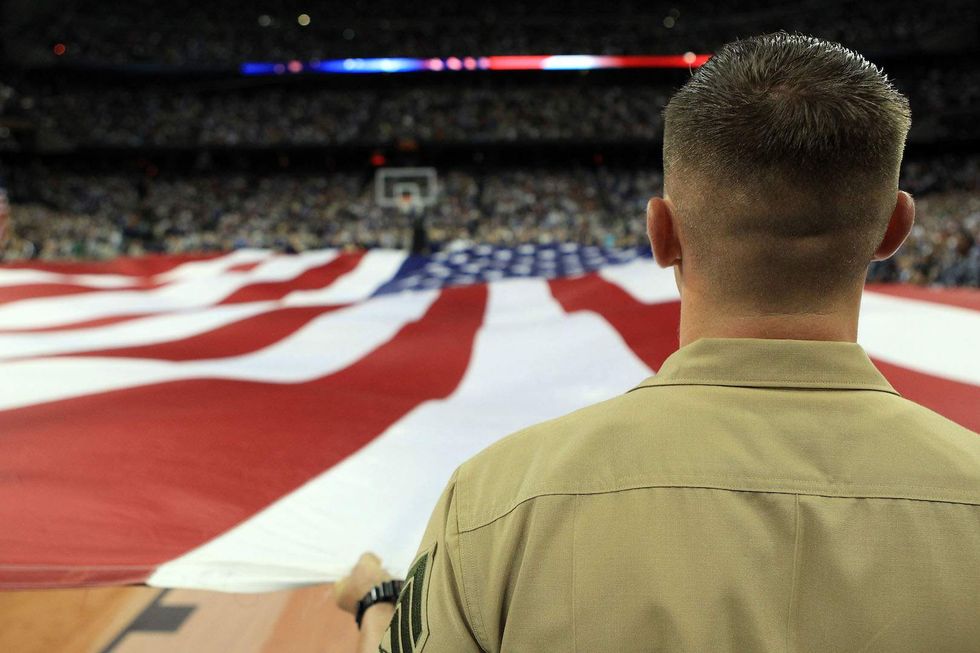 College donor ousted for confronting basketball player who shot during national anthem