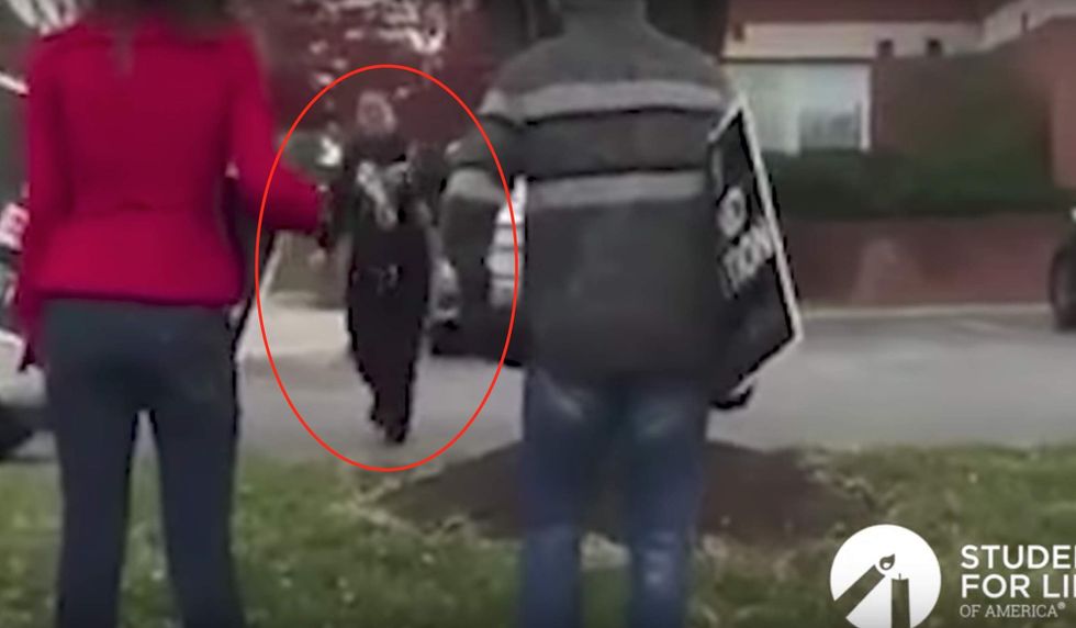 Watch: Pro-life student demonstrating outside Planned Parenthood gets punched in face by angry woman