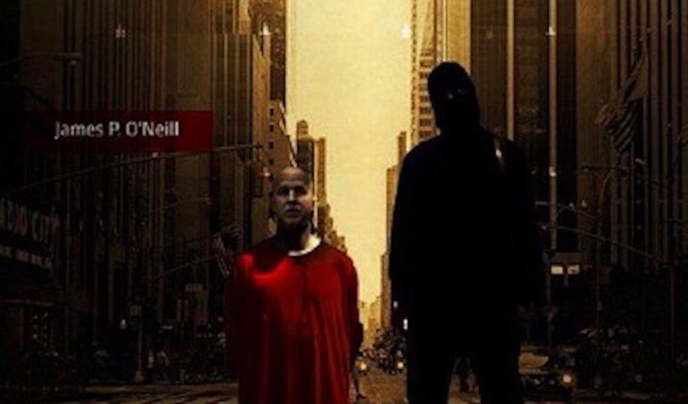 ISIS depicts NYPD commissioner as kneeling prisoner in orange robe next to black-clad terrorist
