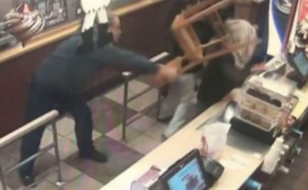 Knife-wielding robber demands cash on Christmas. But bystander sends him away with painful present.
