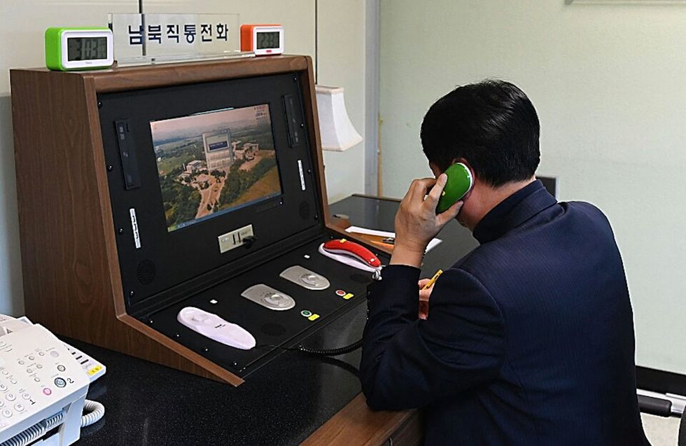 North and South Korea test hotline after Trump taunts Kim Jong Un
