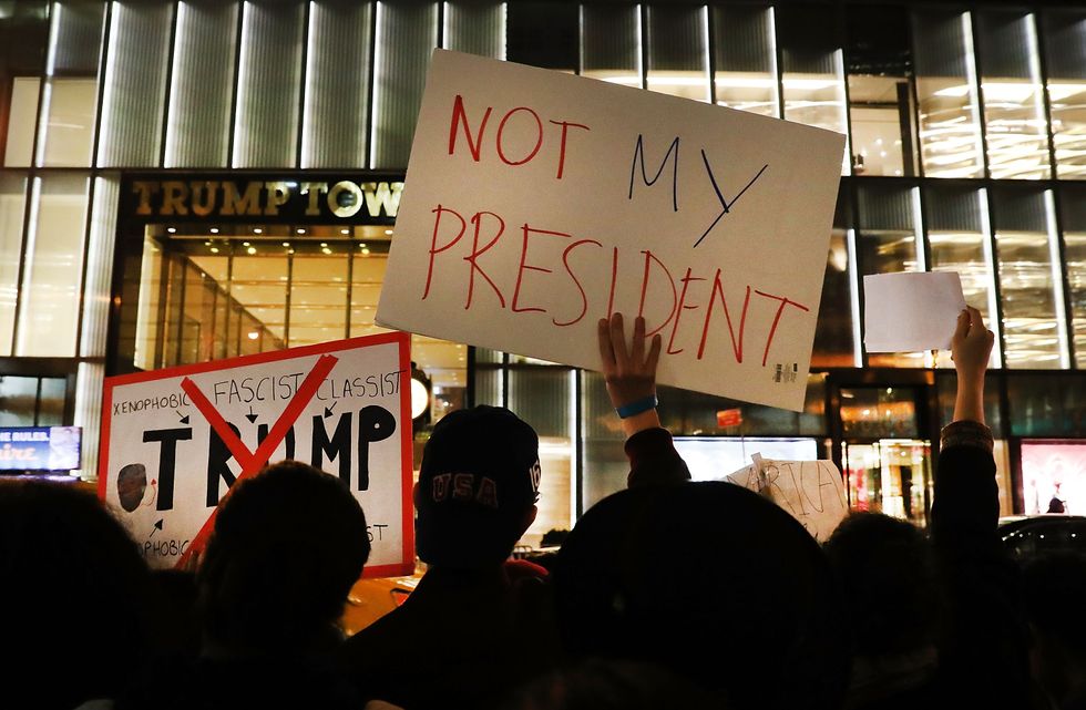 Student hit by car while protesting Trump sues, says school is partly responsible for injuries
