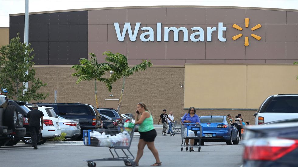 Walmart announces pay hike for employees and then cuts jobs. Here's why.
