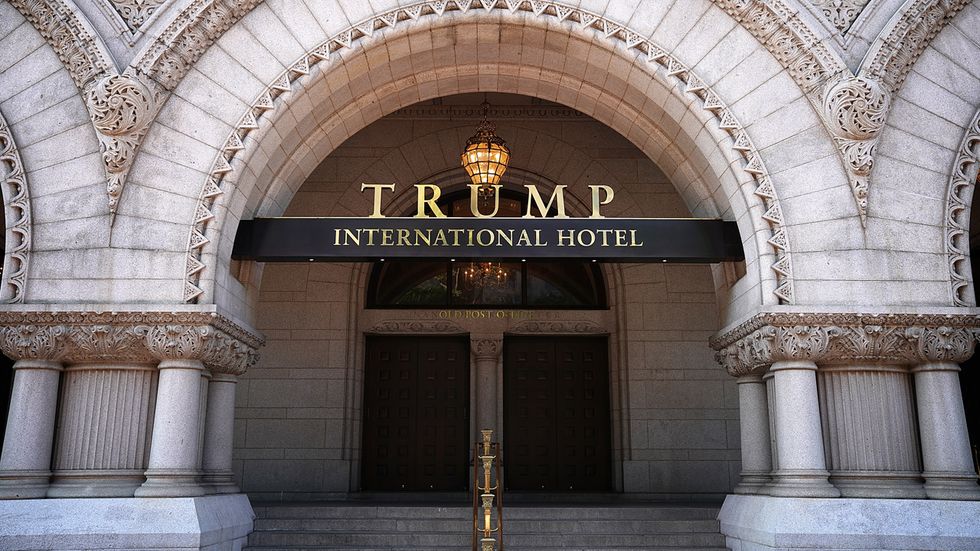 Artist projects animated 'poop' emojis and 's***hole' onto Trump hotel in D.C.
