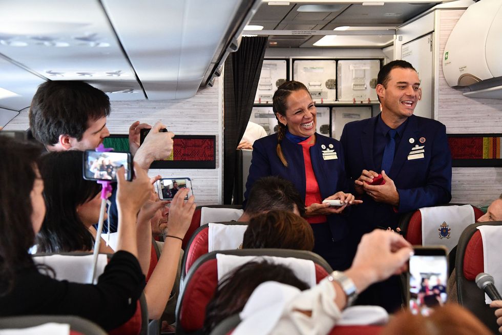 Pope Francis marries couple aboard papal plane