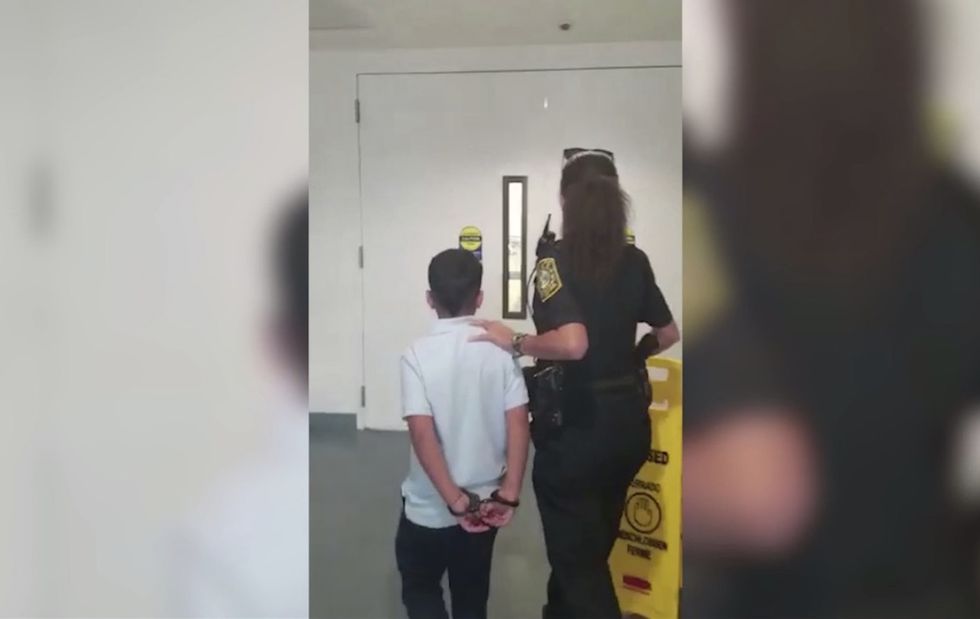 7-year-old boy led away in handcuffs after allegedly punching, kicking teacher. Parents 'in shock.
