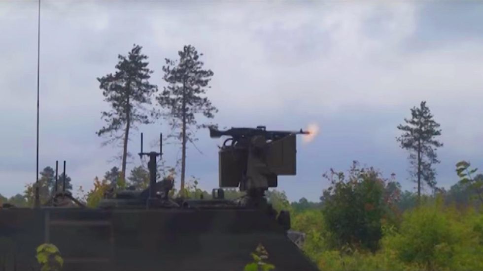 US Army holds drill that pairs live soldiers with ground robots equipped with machine guns