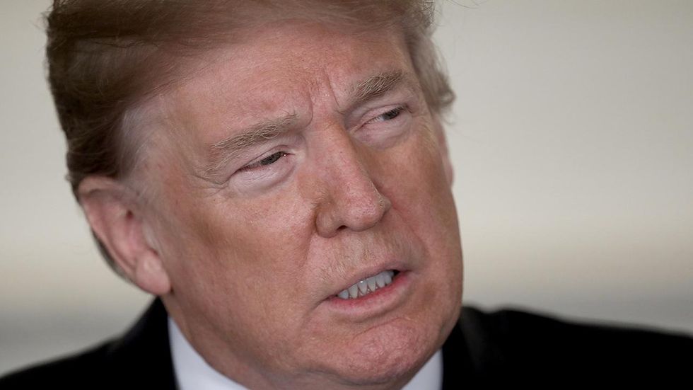 Trump blasts FBI for Florida shooting, says agency too busy with Russia investigation