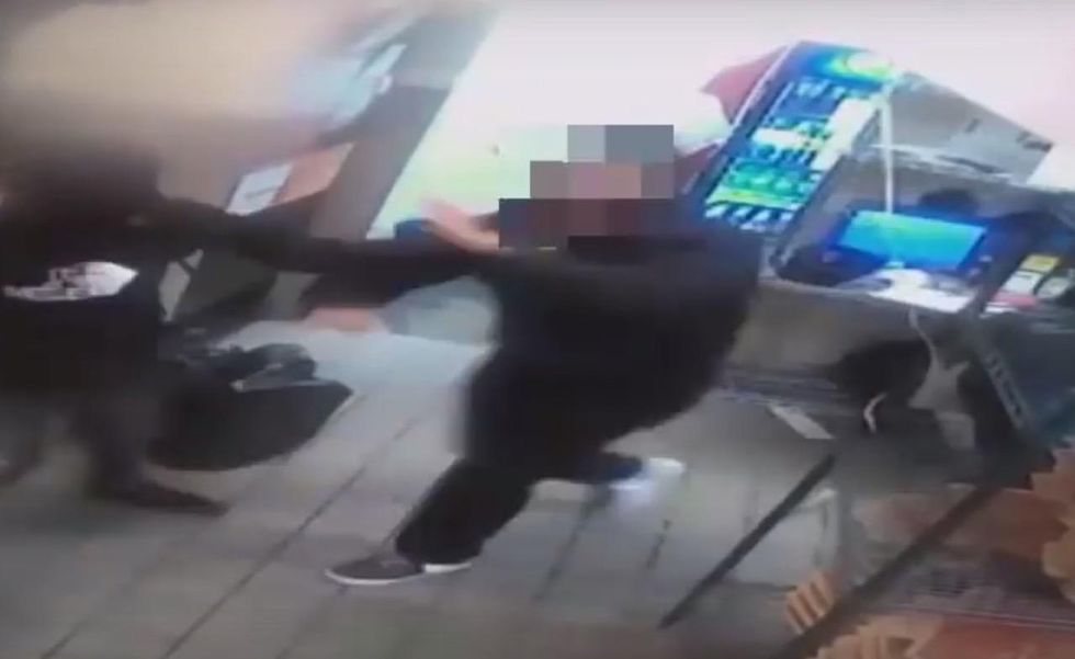 Three gun-toting crooks jump Pizza Hut counter demanding money — and a lone employee takes them on