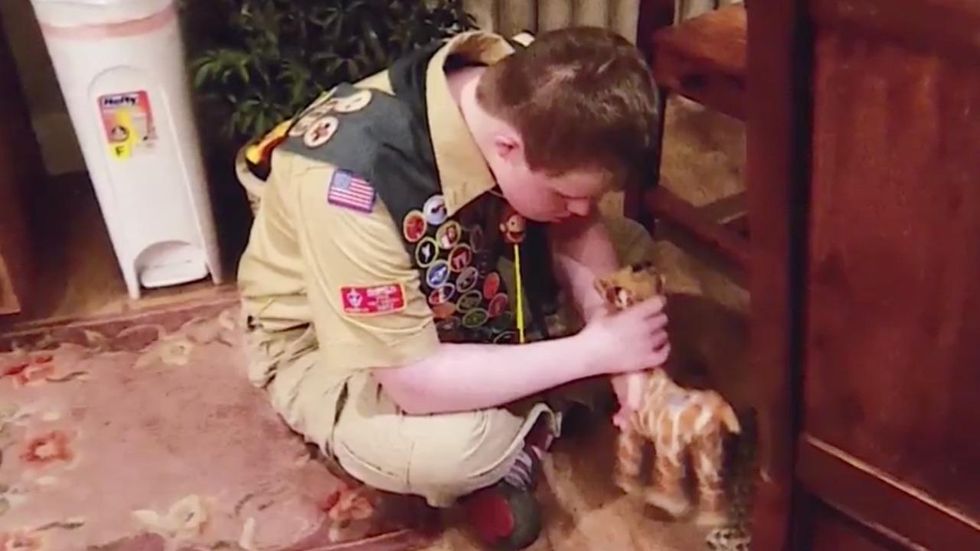 Family of Down syndrome boy sues Boy Scouts for revoking son's merit badges