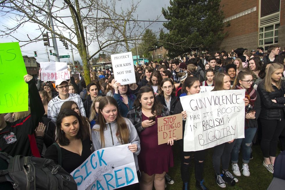 Teacher back at school after being put on leave for questioning double standard in gun protests