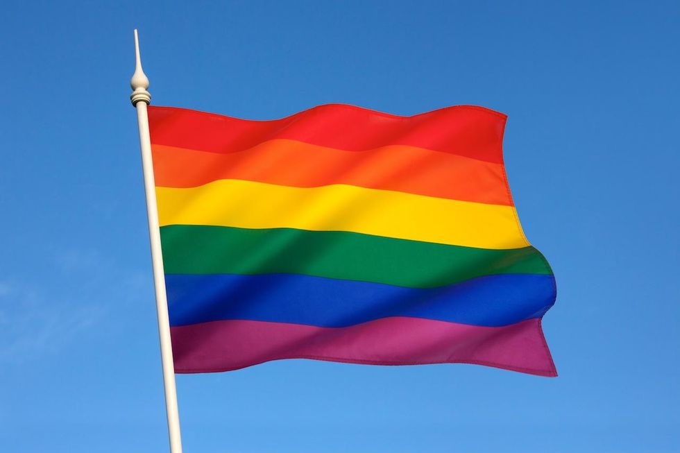 Rainbow flag hangs next to state & US flags as first woman, LGBT California Senate leader takes oath