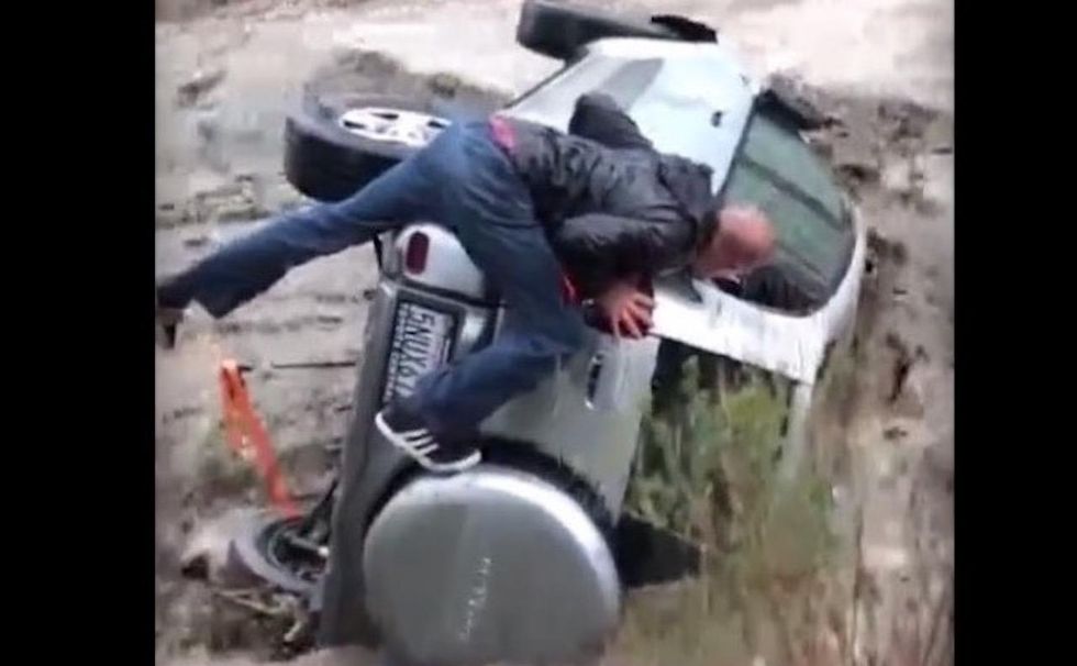 God is great, and I surrendered to him to save me': Watch dramatic rescue from fast-moving flood