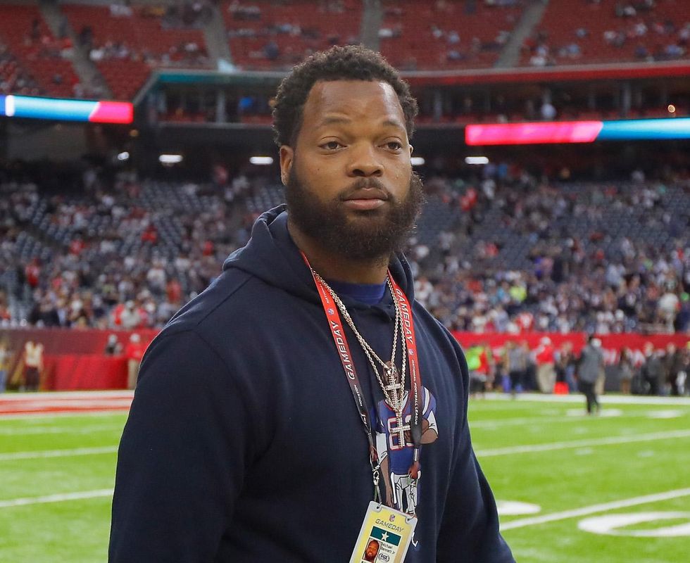 NFL player Michael Bennett turns self in on felony charge of injuring paraplegic elderly woman
