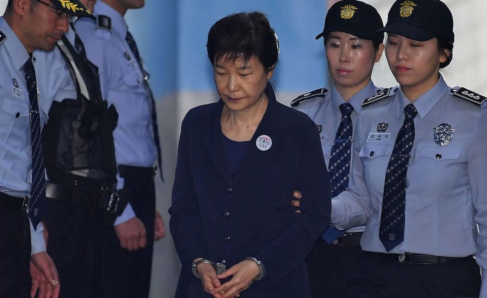 South Korea's ex-president sentenced to 24 years in prison for corruption
