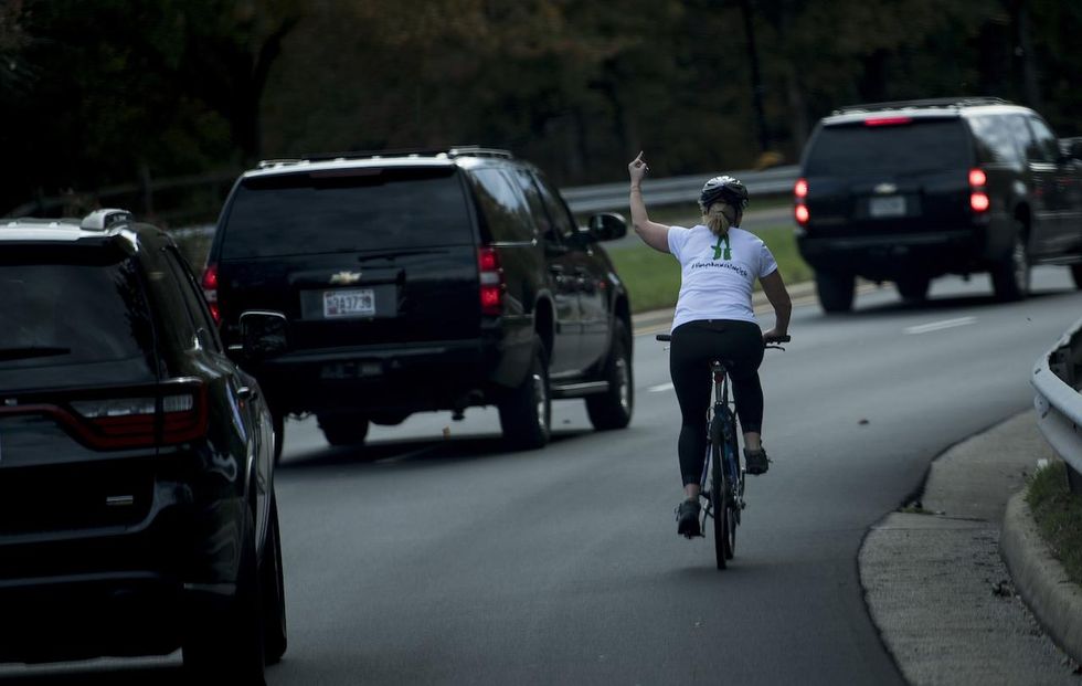 Woman who was fired after flipping the bird at President Trump files lawsuit against former employer