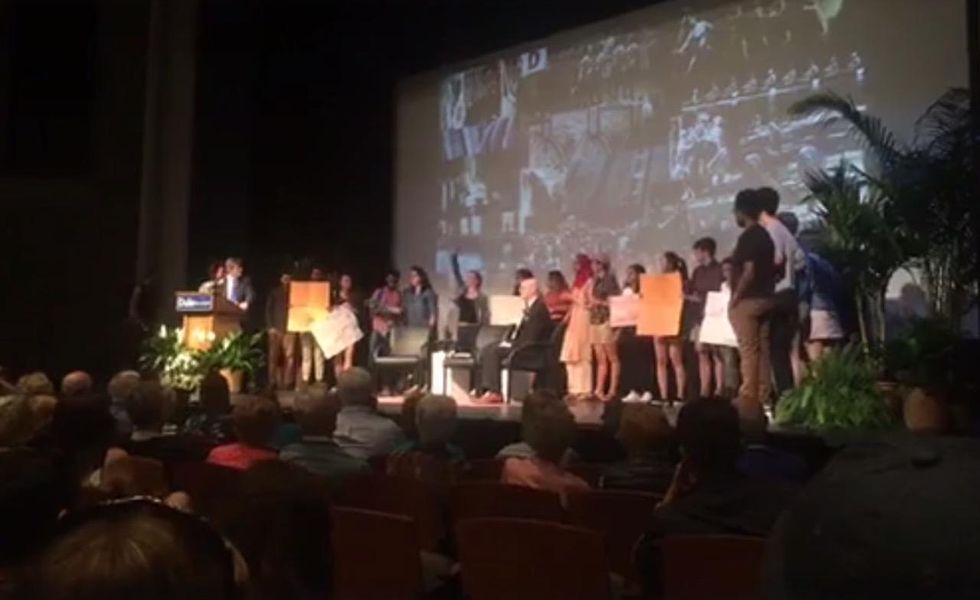 Protesters disrupt college president's speech—and get booed. So, protesters add one more complaint.
