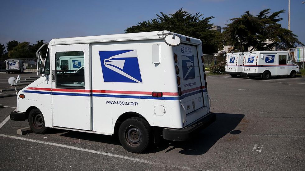 US Postal Service worker saves man, dog from burning home