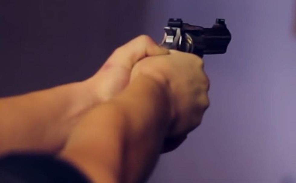 Woman grabs gun after finding front door open. Intruder lunges at her — and she pulls the trigger.