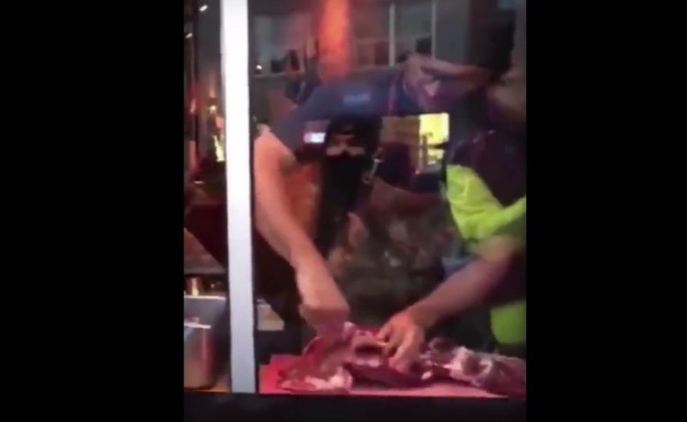 Vegan activists tell restaurant they'll stop protests on one condition. Owner calls it 'extortion.