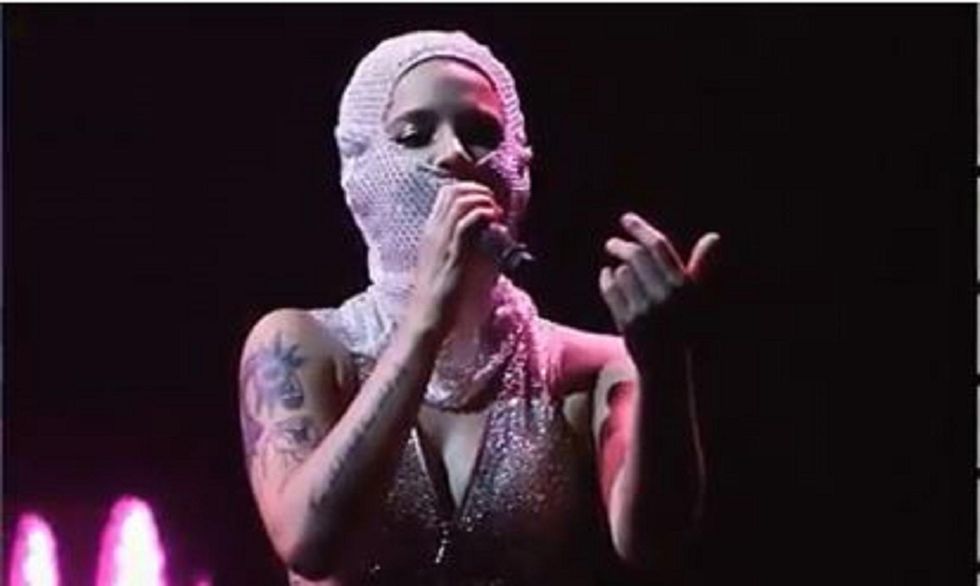 Artist slammed for cultural appropriation for wearing 'ski mask
