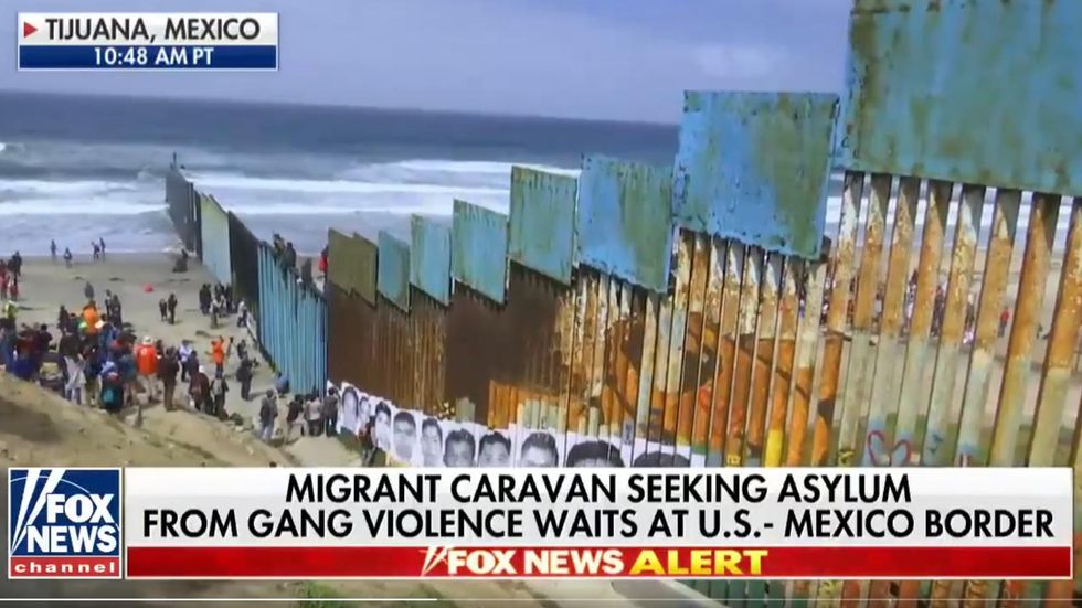 Members of Central American migrant caravan are entering US illegally, scaling border fence