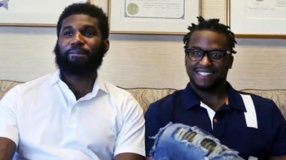 Two black men arrested for loitering at Starbucks reach settlement with coffee chain and city