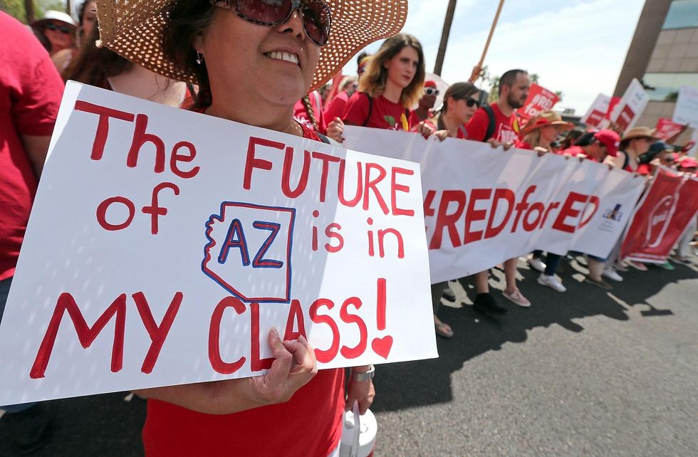 Arizona governor signs bill giving teachers 20 percent raise