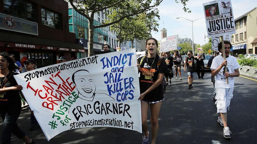Cop in Eric Garner case shows up to be reinstated; NYPD brass change mind, refuse to give job back