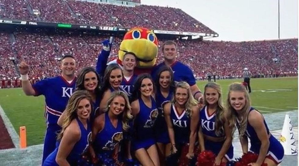 KU cheerleaders say they were stripped naked during hazing by alums, senior squad members