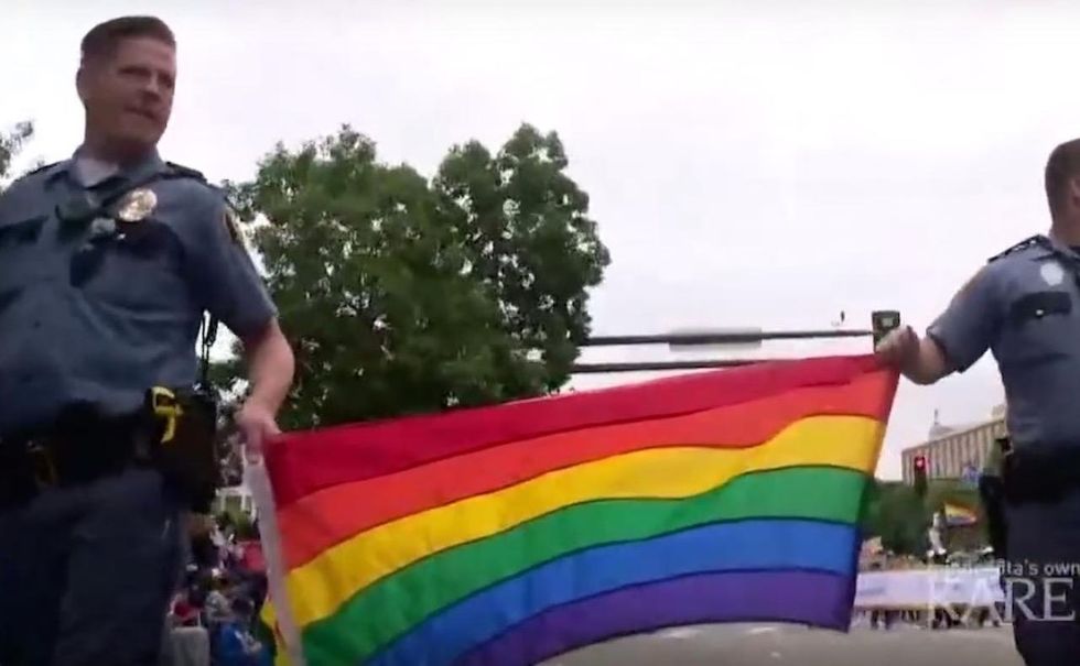 Cops in uniform barred from gay pride parade — but they can wear rainbow T-shirts with badge design
