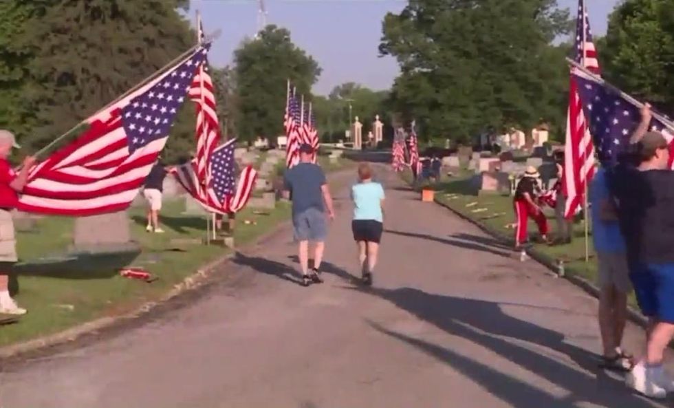 After cemetery vandalized with swastikas just before Memorial Day, small community rises above it