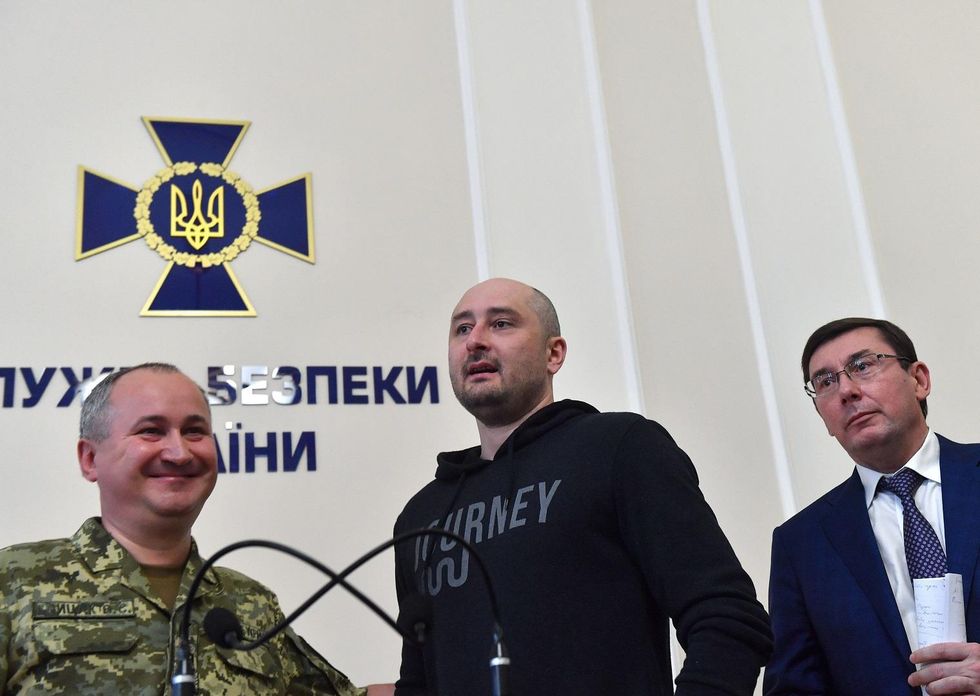 In a bizarre twist, 'murdered' Russian journalist turns up alive