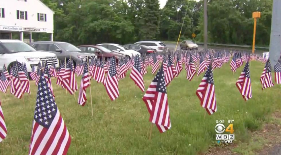 Liberal town tells business to remove 'excessive' American flags. Now the business is fighting back.