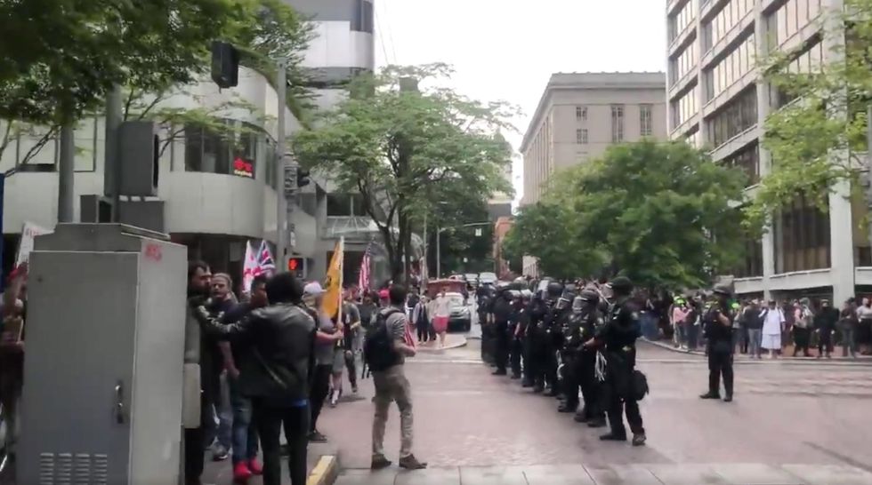 Violence erupts in Portland when black-clad Antifa protesters clash with Patriot Prayer rally