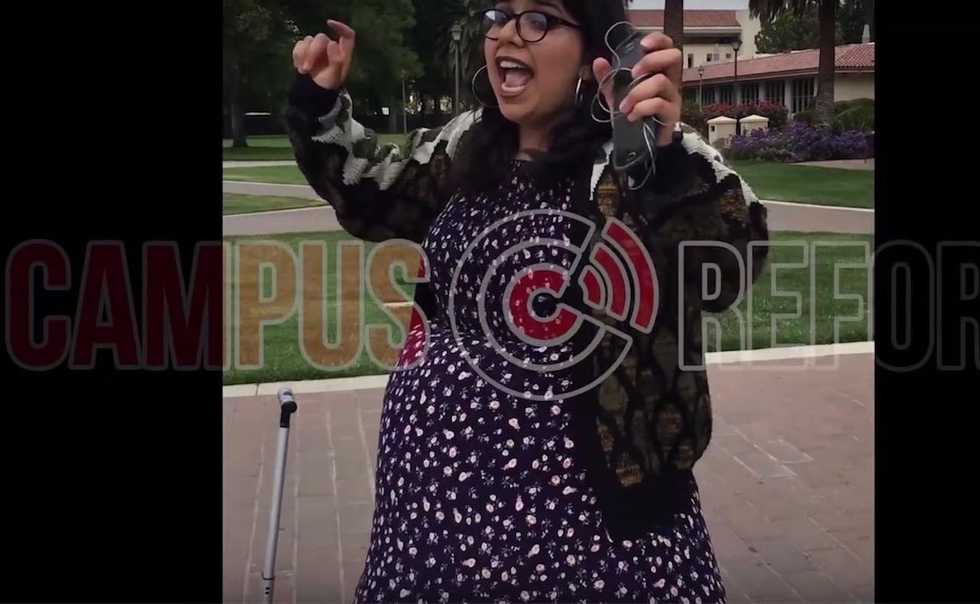Leftist curses out conservative students, rips up their signs — and flees when cops are spotted