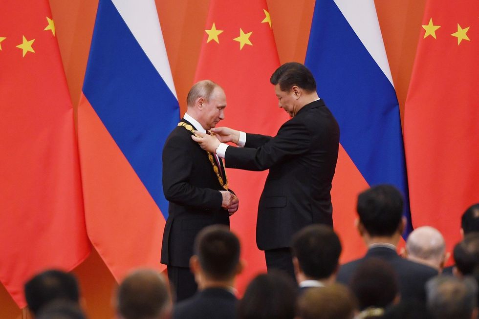 Besties: China presents Putin with friendship medal to recognize 'outstanding contributions