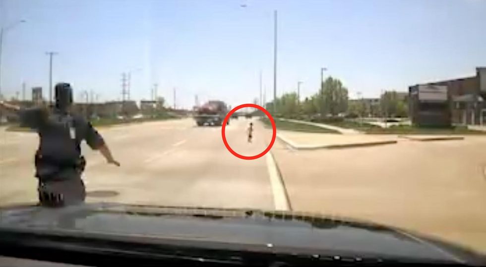 WATCH: Jarring dashcam footage shows hero cop running to save toddler on side of very busy highway
