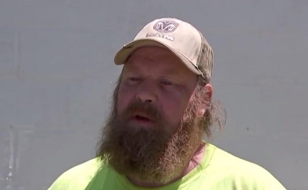 He hears gunshot in Walmart where his wife works. So he rushes inside and faces down the crooks.