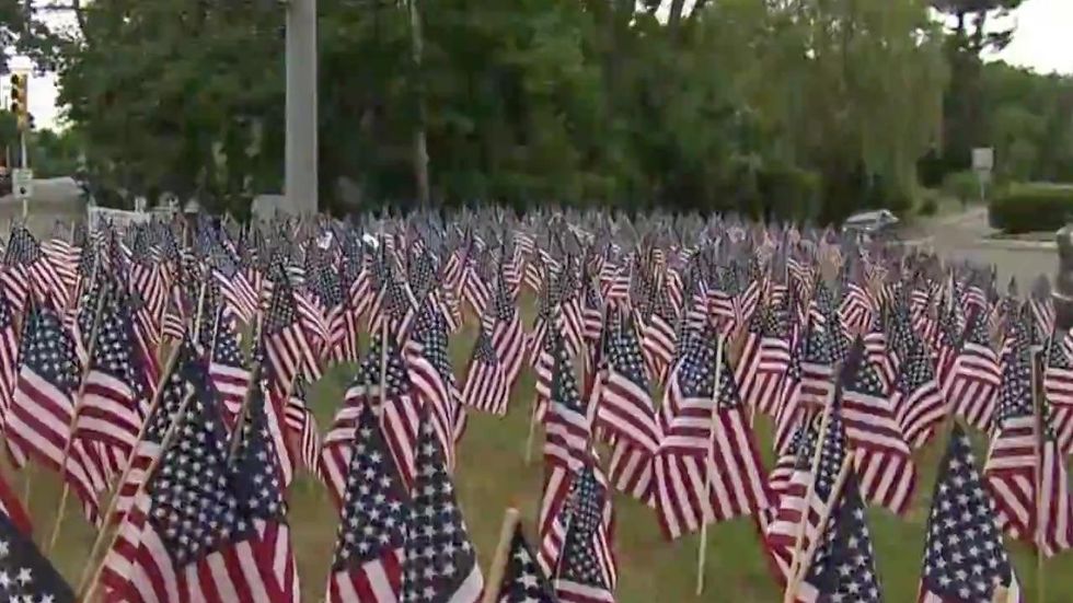 Liberal town surrenders in fight over a massive flag display: 'We’re all better for it in the end\
