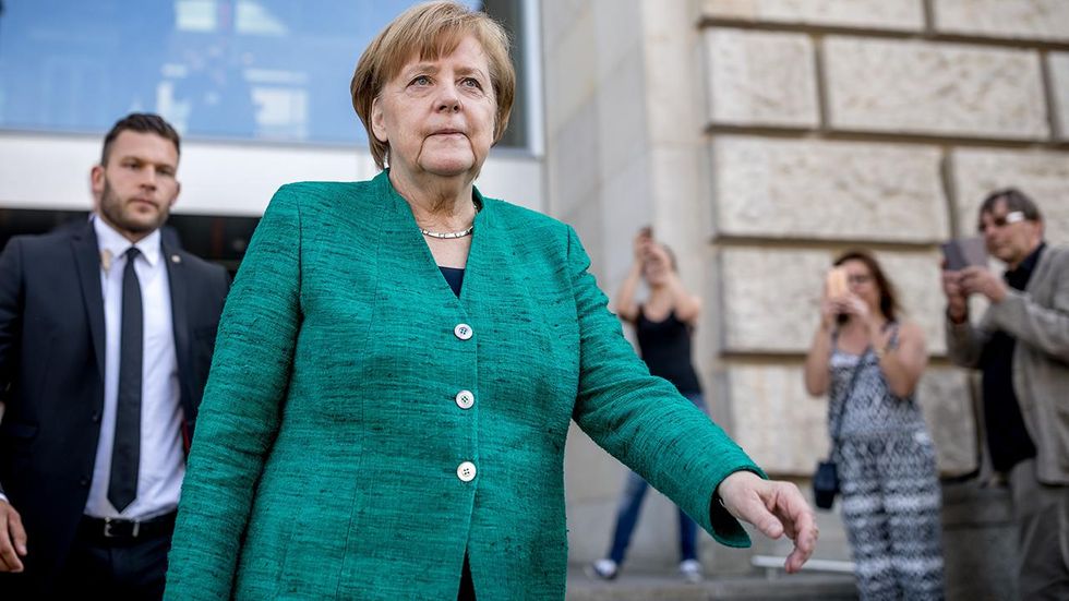 German government teetering on collapse over Chancellor Angela Merkel's immigration policies