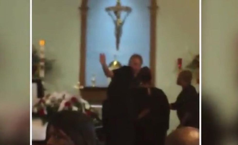 Get the hell out of my church!': Catholic priest goes ballistic on grieving family at funeral