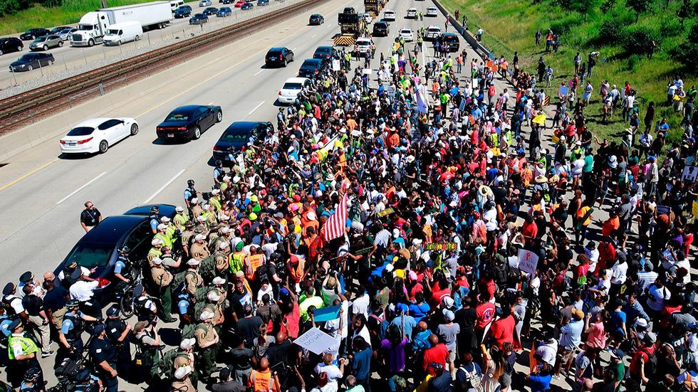 Hundreds of protesters shut down Chicago freeway to draw attention to city's homicide problem