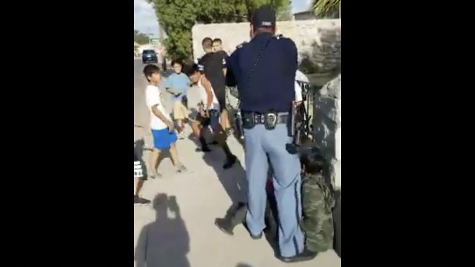 Viral video shows cop pulling a gun on group of foul-mouthed children — now he’s under investigation