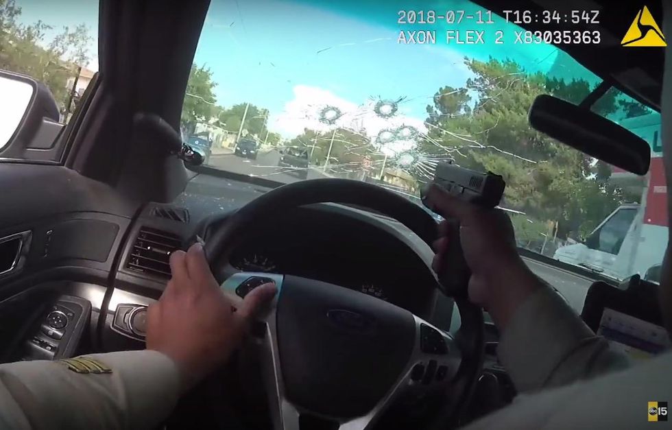 WATCH: Cop fires 11 shots through his windshield at murder suspects during high-speed chase